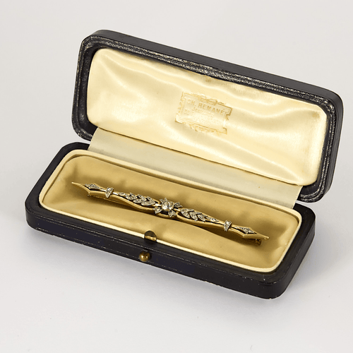 Spona brož ve žlutém a šedém zlatě, diamant starého brusu, růžově broušené diamanty.