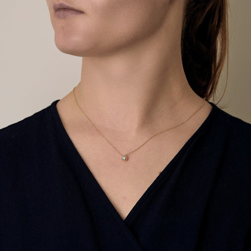 Necklace Solitaire in yellow gold and white gold, diamond approximately 0.15 carat.