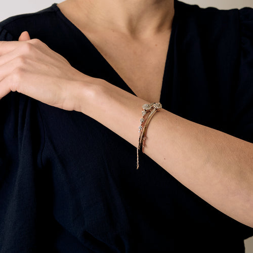 Bracelet jonc ouvrant en or rose, or blanc et diamants