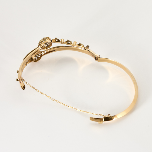 Bracelet jonc ouvrant en or rose, or blanc et diamants