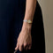 VAN CLEEF & ARPELS - Steel and gold-plated steel watch with round case and quartz movement