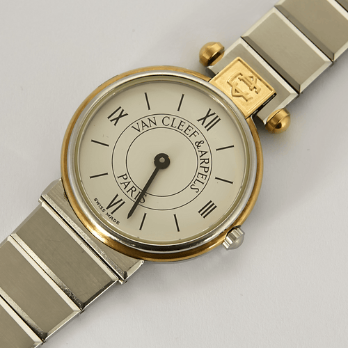 VAN CLEEF & ARPELS - Steel and gold-plated steel watch with round case and quartz movement