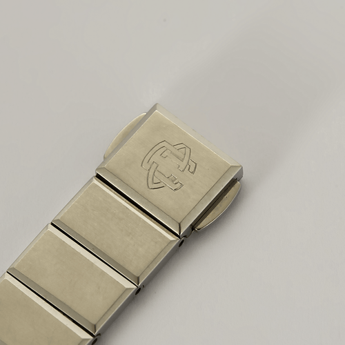 VAN CLEEF & ARPELS - Steel and gold-plated steel watch with round case and quartz movement