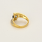 Anillo de aro cruzado de oro amarillo, oro gris, zafiro y diamantes