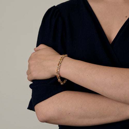 Náramek ze žlutého zlata a oranžových safírů