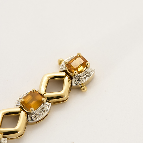 Náramek ze žlutého zlata a oranžových safírů