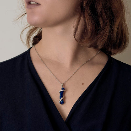 Chain and Pendant in white gold, lapis lazuli, and small diamonds.