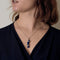 Chain and Pendant in white gold, lapis lazuli, and small diamonds.
