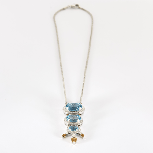 Collar de oro gris, diamantes y topacios azules, citrinos