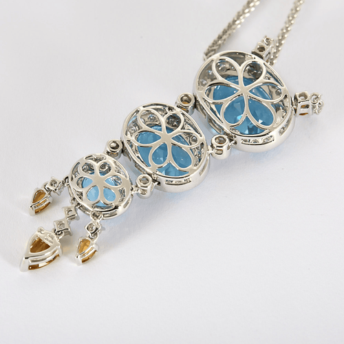 Collar de oro gris, diamantes y topacios azules, citrinos