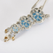 Collar de oro gris, diamantes y topacios azules, citrinos