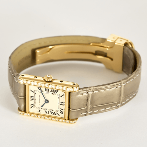 Cartier Reloj Tank de oro amarillo y diamantes