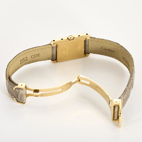 Cartier Reloj Tank de oro amarillo y diamantes