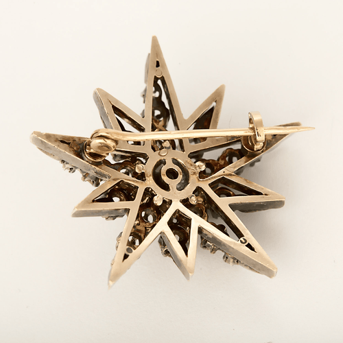 Elegant Napoleon III period brooch in rose gold doubled with silver featuring a star motif