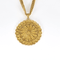 Collier en or jaune à maille gourmette et pendentif filigrané à motif de fleur 58 Facettes DV32806-5