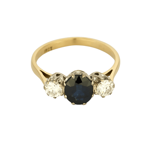 White gold ring with sapphire and diamonds