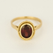 Elegant yellow gold and almandine garnet ring