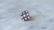 https://cdn.shopify.com/s/files/1/0075/4588/0666/files/bague-ancienne-damier-diamants-et-rubis-calibres-647273.jpg?v=1740462131