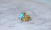https://cdn.shopify.com/s/files/1/0075/4588/0666/files/bague-cocktail-turquoise-et-diamants-or-jaune-455035.jpg?v=1739836430