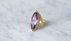 https://cdn.shopify.com/s/files/1/0075/4588/0666/products/bague-or-et-amethyste-annees-70-395043.jpg?v=1701890510