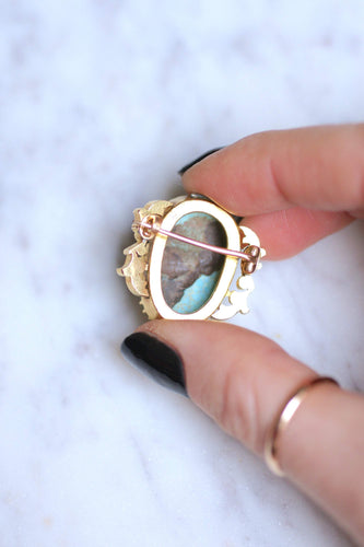 https://cdn.shopify.com/s/files/1/0075/4588/0666/products/broches-broche-ancienne-en-or-18kt-et-camee-turquoise-xixe-siecle-9.jpg?v=1613360426