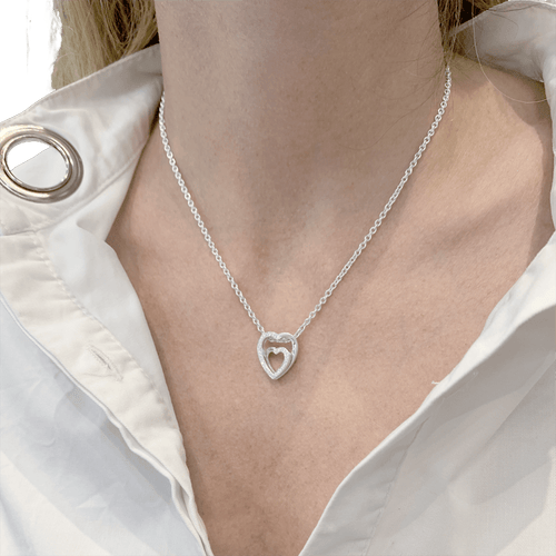 Collier Cartier Cœurs - Collier en or blanc et diamants 58 Facettes 34760