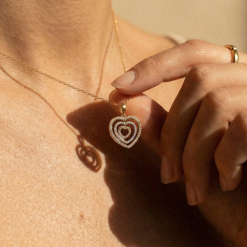 Tricolor heart pendant in 14-carat gold with diamonds 58 Facettes