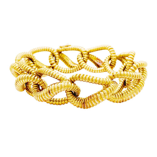 Bracelet Mellerio - Bracelet vintage à maillons torsadés en or jaune 18 carats 58 Facettes 35262