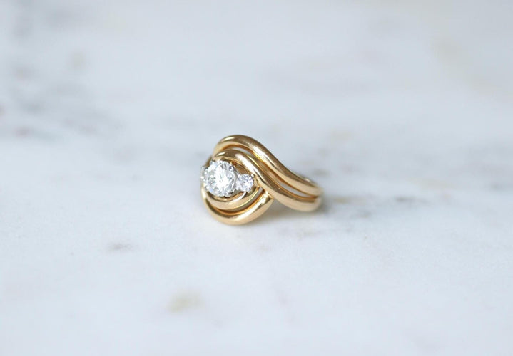 Ring 50 Wirbelring aus 18k Roségold und Platin und Diamanten 58 Facettes