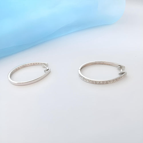 Boucles d'oreilles Boucles d'oreilles créoles ovales en diamants Or blanc 18K 58 Facettes 1761