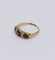 Bague 58 Bague jarretière ancienne en or jaune, sertie de grenats et diamants 58 Facettes