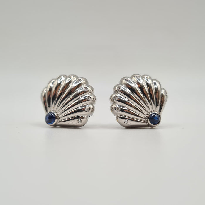 White gold shell earrings set with diamonds and sapphires