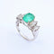 Bague 54 Bague en or blanc, émeraude et diamants 58 Facettes