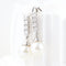 Boucles d'oreilles Boucles d'oreilles en or blanc 18 carats serties de diamants et de perles 58 Facettes