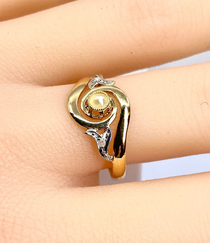 Bague 58 Bague en or jaune en perle et diamants sertis en or blanc 58 Facettes AB584