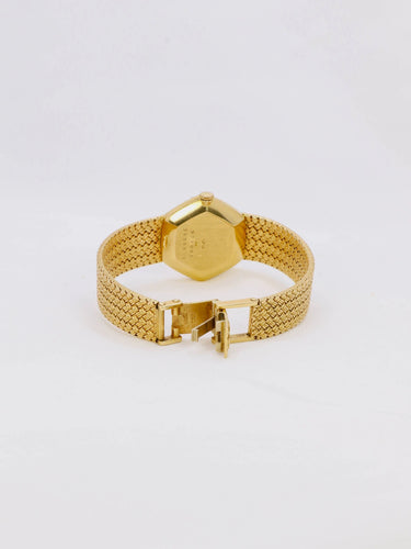 Montre BAUME & MERCIER - Montre vintage or jaune maille tressée 58 Facettes 1067.3