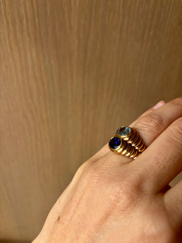 Bague Bague Bulgari Double Baccellato en or, topaze bleue et iolite 58 Facettes
