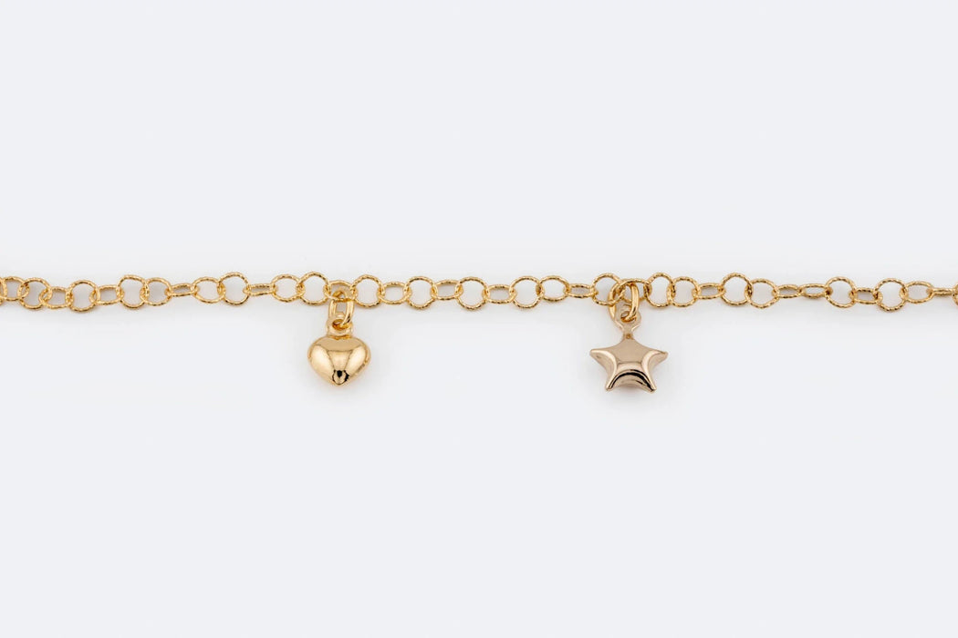 Bracciale in oro giallo con stelle e cuori