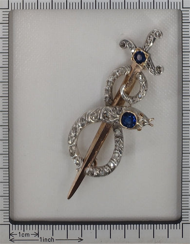 Broche Broche antique en or, diamant et saphir, serpent enroulé autour d'une épée ou d'un poignard 58 Facettes 22297-0136