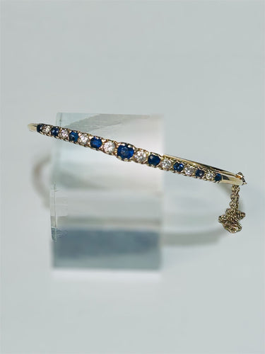 Bracelet Bracelet rigide en or jaune, diamants et saphirs 58 Facettes 259009