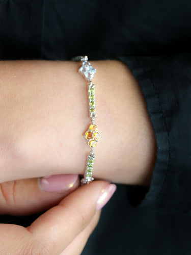 Bracelet Bracelet ligne or blanc citrines péridots topazes bleues 58 Facettes 1CA0000006/1