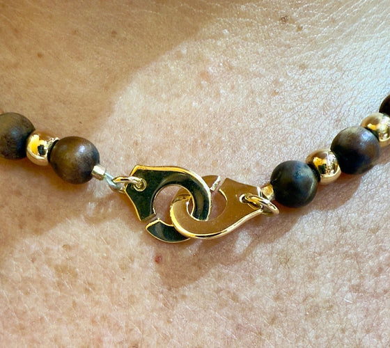 Collier Collier Dinh Van en or jaune 18 carats et boule en bois 58 Facettes