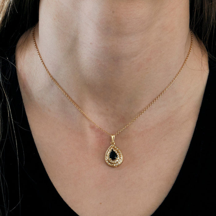 Yellow gold pendant set with a sapphire and diamonds
