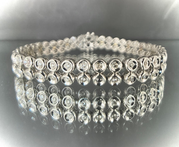 Bracelet Bracelet rivière or blanc double orné de 80 brillants de 0,03 carat chacun 58 Facettes