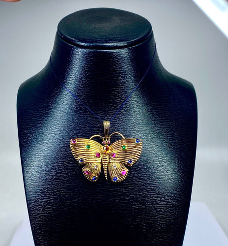 Pendente a farfalla in oro giallo e pietre preziose 