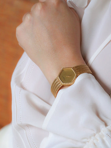 Montre BAUME & MERCIER Montre vintage or jaune maille tressée 58 Facettes 1067.3