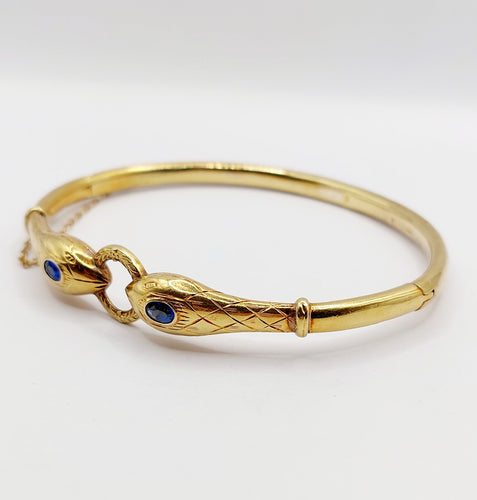 Bracelet Bracelet serpent à deux têtes or jaune et pierre bleues (circa 1920) 58 Facettes A06347