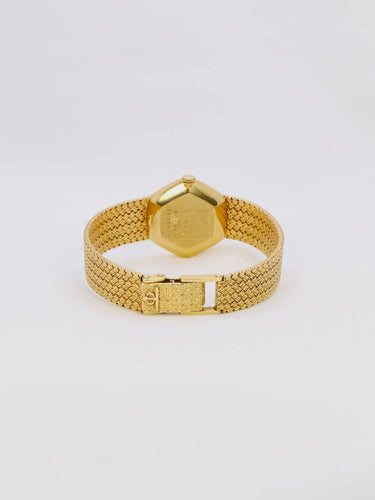 Montre BAUME & MERCIER - Montre vintage or jaune maille tressée 58 Facettes 1067.3