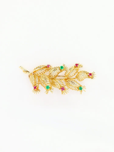 Broche GUBELIN Broche feuille or rubis émeraudes 58 Facettes 1126.1