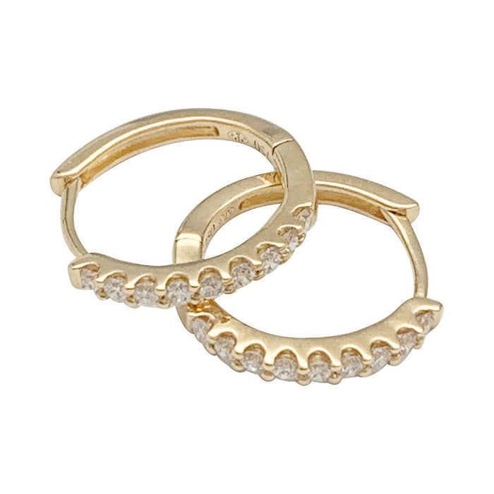 Pair of small yellow gold hoop earrings with diamonds.